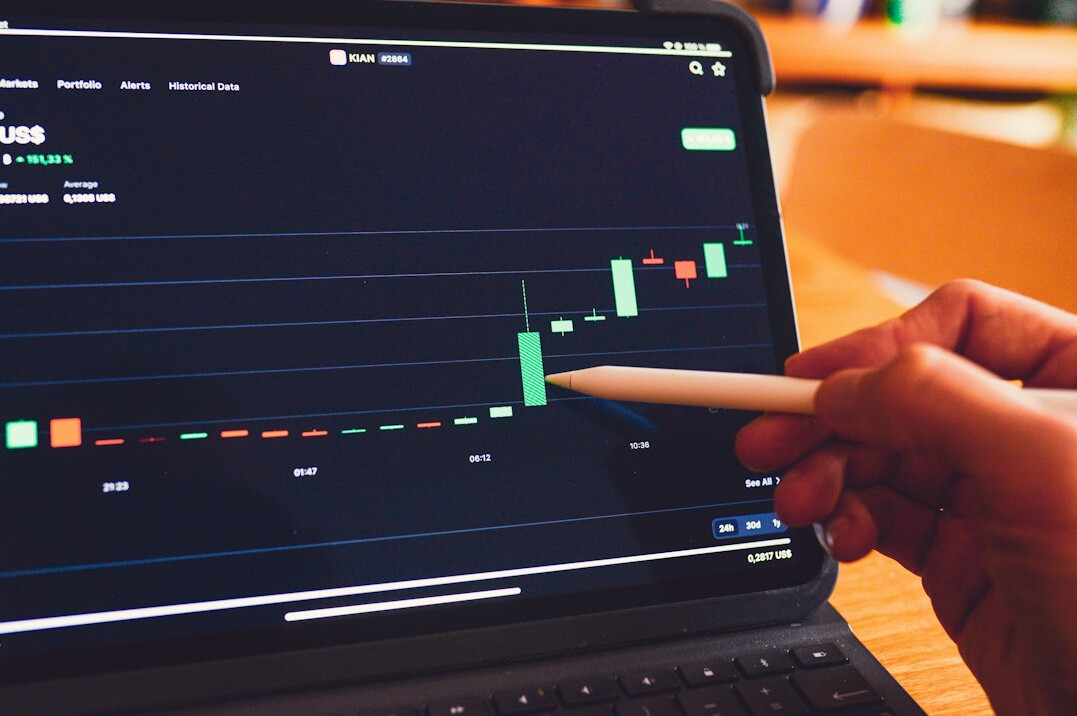 Laptop with analytics charts on a desk